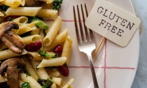 A dish displays penne pasta salad and red kidney beans with a sign that reads “gluten-free,” the type of meal you might find at one of D.C.’s enticing gluten-free restaurants.