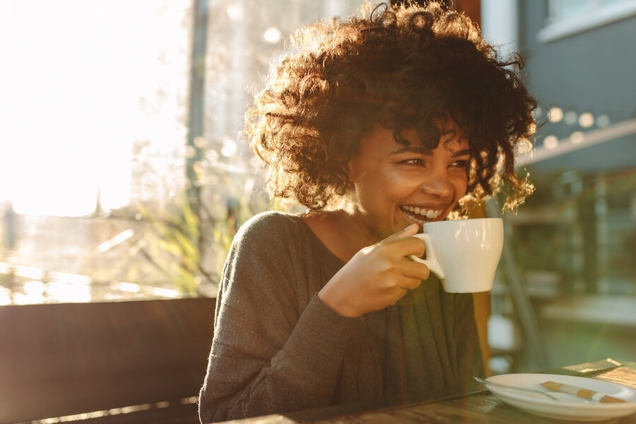 Woman is enjoying the natural benefits of coffee